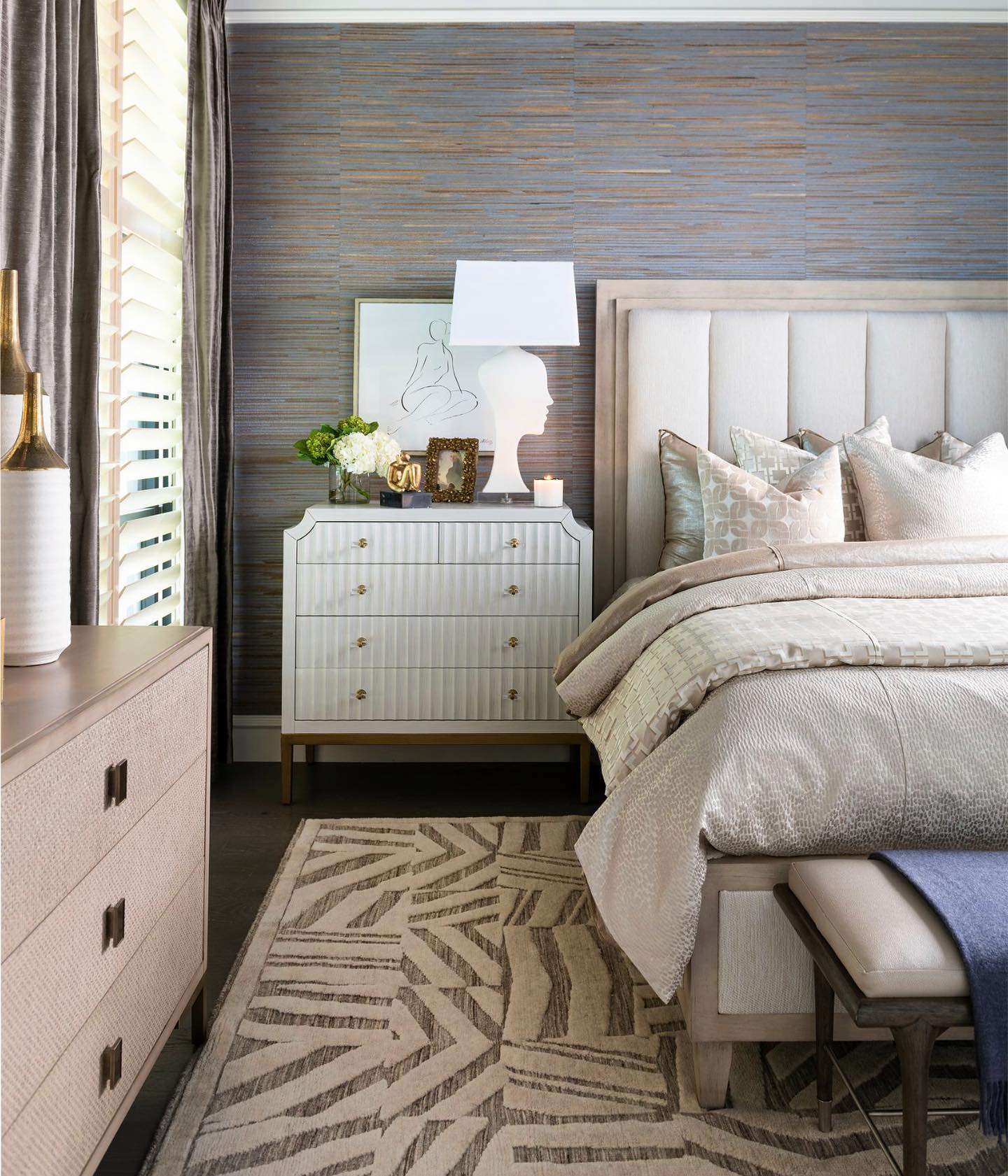 Layers of textures combined with a #neutralpalette - yes please!! See more of this peaceful #primarysuite in the #springissue of #IBBatHome. Design by #ibbdesigner Kay Lewis. All furnishings & accessories available through our store in #Frisco. #interiordesign #Dallasdesign #custombedding #neutralcolors #layeredinterior #bedroomdesign #teamIBB #ibbdesign